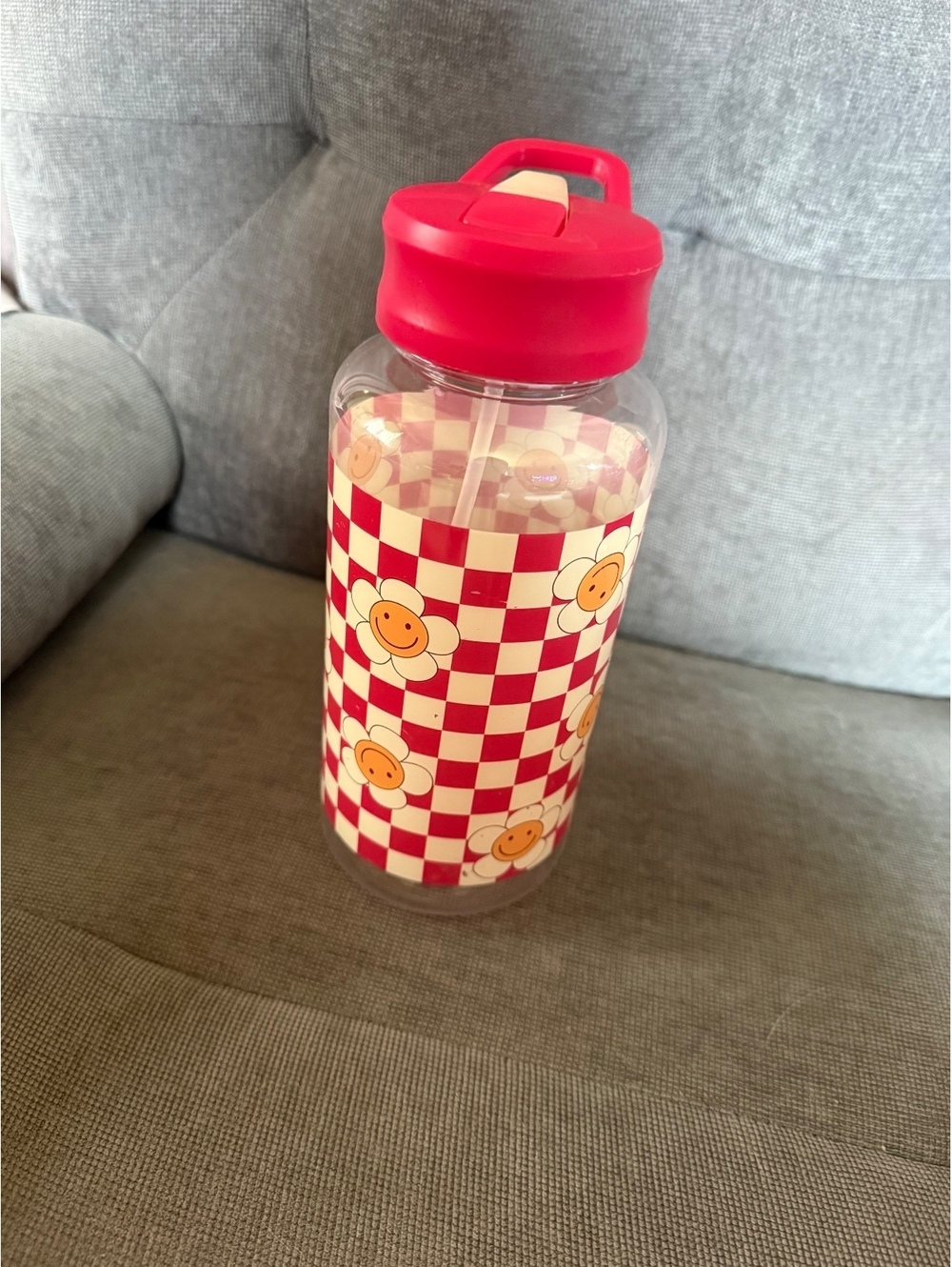 Plastic Water Bottle with Red Checkered and Smiley Flower Design